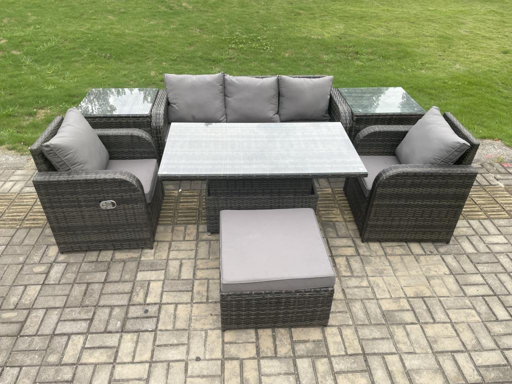 Rattan garden dining set with sofa, height-adjustable dining table, 2 reclining chairs, and stools. Dark grey.